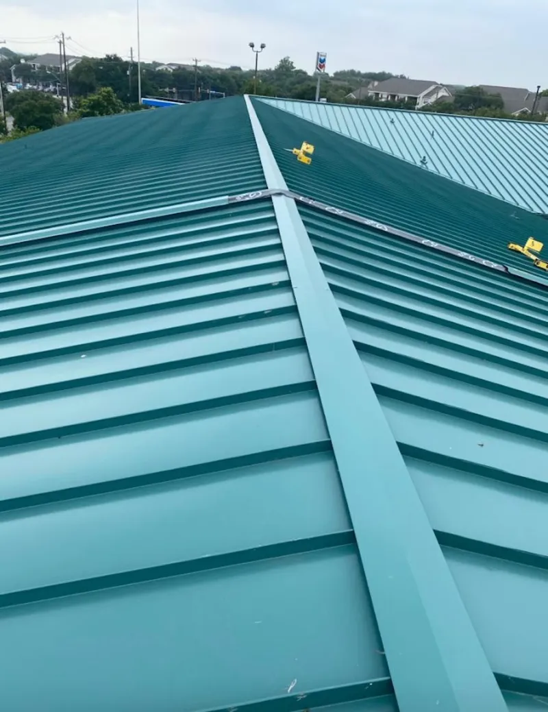 Green commercial metal roof ridge and valley for Metal Roof Repair in Brookline